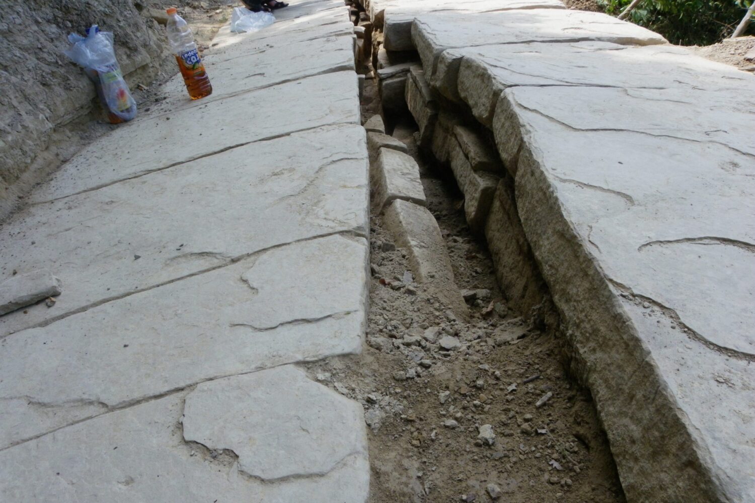 Close-up of stone slabs forming a section of the Bosnian Pyramid terraces during excavation.