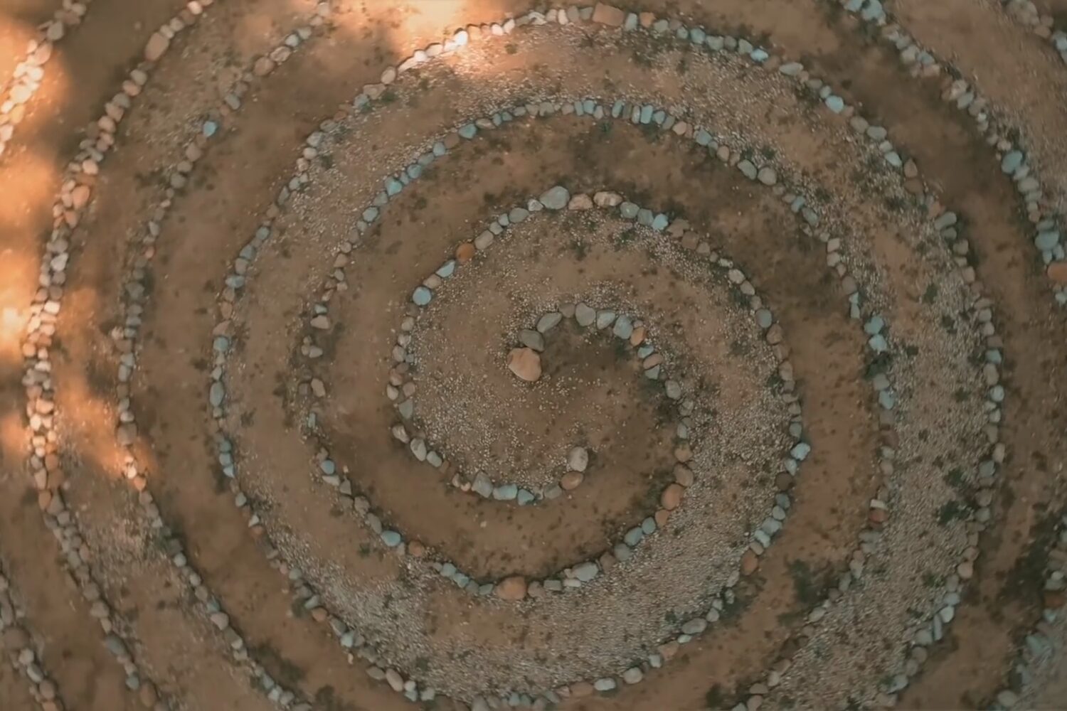 Aerial view of a stone spiral labyrinth at the Bosnian Pyramid complex.